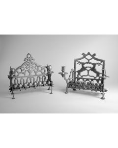 Back wall openwork, below, row with swirl; above, central flowering urn flanked by birds, with border which rises to flank loop finial. Side walls rise from feet to support candleholders with bobeches. Oil row consists of urn form containers. H: 220mm.