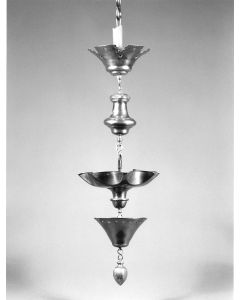 Central section of six pointed star form, surmounted by baluster knop and crown, pierced in several places with heart and star form shapes, fitted below with drip pan and acorn form knop.  H:  720mm.