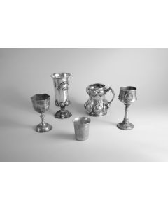 Flat-bottomed beaker, overall engraved with foliate decoration, with three rondels engraved with labelled architectural depictions:  The Tomb of the Partriarchs, The Tomb of the House of David, and the Western Wall.    Marks:  Poland, 1847.  H:  70mm