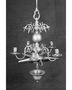 Trefoil loop, bulbous shaft with five cast swirl and bead ornaments near top; near base, five candleholders on S-form arms atop 5 pointed star form oil container; drip bowl hangs from base of shaft. H: 500mm.