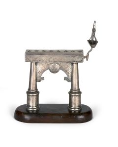 EXEMPLARY SILVER CHANUKAH LAMP ON WOODEN BASE.