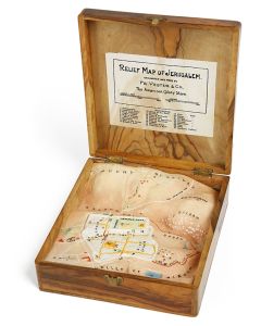Interior fitted with multicolor plaster-of-Paris plan of Jerusalem. Locations numbered, with printed key to map pasted to top of lid. Clasp-lock. Manufactured by Fr. Vester & Co. for The American Colony Store (Hotel), Jerusalem