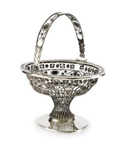 Ovoid filigree basket with alternating floral and star motifs; swinging carrying-handle. 8.5 x 7.0 inches.