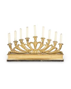 Nine-branched Menorah set on wooden base, with gilded finish. Fitted with proportionate-sized candles. 18 x 40 inches.