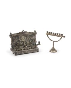 Backplate depicting the Priestly lighting of the seven-branched Temple Menorah; related Hebrew verses; set above with three colored stones. Row of eight candle candleholders. 5 x 7.5 inches.