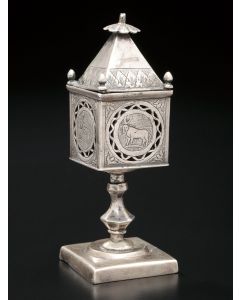 Single tier tower, engraved on four sides with animal representions. Set on knop stem and matching square base. Marked. Height: 4.5 inches.