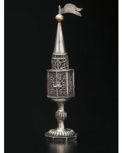Octagonal spice chamber comprised of filigree panels with hinged door; rounded steeple and pennant finial set on knop stem and octagonal base. Marked. Height: 8.5 inches.