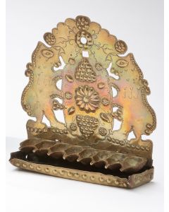 Scalloped sheet-brass backplate pierced with rampant animal figures; embossed and tooled fruit and flower motifs, punch-beaded border. Original cast row of oil fonts attached over drip-pan. 10 x 9 inches.