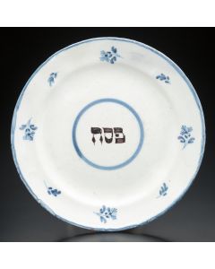 Painted in blue tones under glaze with the word “Pesach” at center. Diam: 9.5 inches.