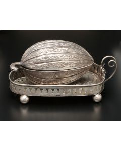 Fruit-form container with hinged lid set on tray with with stem and leaf handle, with four ball supports. Marked. Length: 6 inches.