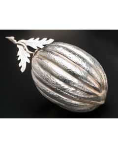Textured fruit-form container with removable cover and leafy stem. Marked. Length: 8 inches.