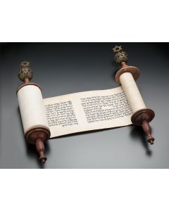 Complete manuscript Esther Scroll on vellum, set on two wooden rollers (Torah Scroll-style), each with applied pierced orb set surmounted by Star-of-David. Height of scroll: 5 inches.