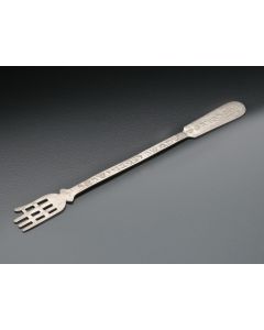 Flat body engraved with Hebrew inscription, terminating in large stylized hand. Length: 10 inches.