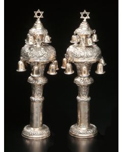 Two tiered bulbous form, each tier hung with bells and topped with Star-of-David finials, decorated throughout with floral designs. Hebrew dedicatory inscription. Marked. Height: 14 inches.