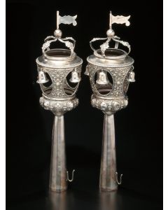 Single tier chased in a neoclassical design hung with bells within tower windows, topped by crown and flag finials, on elongated tubular staves. Marked. Height: 14 inches.