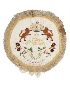 Each comprised of three titled sections, uppermost featuring embroidery with traditional iconography and relevant Hebrew text. Decorative tassel borders. Diam: 17.5 and 16 inches. Each framed.