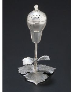 Pierced container of flower-bud form set on naturalistic leaf base. Marked. Height: 4.5 inches.