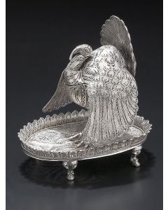 Extravagant turkey form, set on oval base with scalloped trim on four supports, with hinge torso. (Later bolts.) 8 x 6.25 x 7.5 inches.