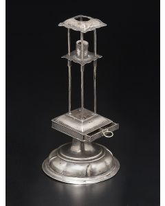 Of square-form, with four-sectioned drawer for spices. Four vertical rods above, with central sliding element to hold candle. Marked. Height: 8.25 inches.