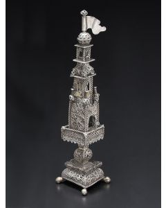 Four graduating rectangular tiers with filigree ball and pennant finial (later). Matching filigree square base, set on ball and claw feet. Single bell in belfry section and surrounded by four pennants at corners. Hinged filigree door. Height: 9.75 inches.