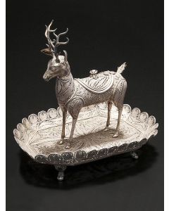 Extravagant deer form, set on octagonal base with scalloped trim on four supports, with hinged door on back. 9 x 9 x 6.5 inches.
