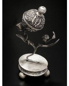 Pierced container of flower-bud form set on naturalistic leafy stem with miniature buds and bird. Screw-on ball finial lock. The whole, set on round base supported by three ball feet. Marked. Height: 8 inches.