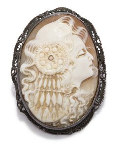 Oval cameo depicting stylish woman in profile, with elaborate (opal?) hair ornament set in her wispy coif. Set in mounting. C-clasp closure. 2 x 1.5 inches.