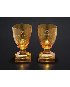 Tulip-form bowls bearing etched Hebrew wine blessing and Star-of-David, set on fluted stem and square base. Height: 4.75 inches.