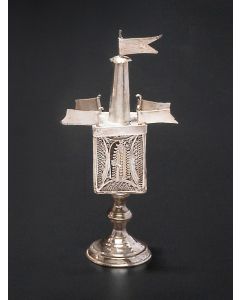 Rectangular filigree chamber surmounted by four pennants and rounded steeple topped with pennant finial. The whole set on rounded base. Hinged filigree door. Marked. Height: 6 inches.