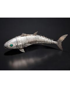 Scaled body with dorsal fins and articulated joints; hinged head, teethed mouth, along with eyes inlaid with green cabochon stones. Marked. Length: 14 inches.
