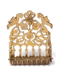 Arched backplate pierced with arcade below stylized flowers, fronted by row of eight oil receptacles. Two birds in profile flank a trefoil finial. With servant light. 5.25 x 4.5 inches.