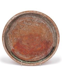 Circular plate with raised rim, engraved with stylized, organic motifs interlaced with arabesque patterns including central, six-sided star surrounding Hebrew calligraphic word: “Nifrah.” Diameter: 11 inches.