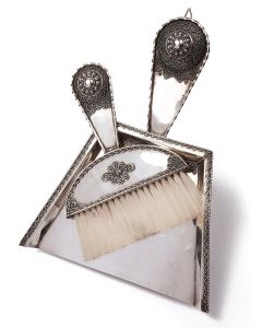 Delightful geometrically-shaped, miniature shovel and brush set with applied filigree in heart-shape and concentric circle pattern, with silver bosses on handles. Clip on brush reverse for attachment to shovel. Marked.