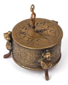 Verge Fusee mechanical clock features dial numbers engraved in Hebrew letters. Set on round pedestal with neoclassical devices and supported by three, footed female busts. With glass underside and visible movement. Height: 1.75 inches. * With clock key.