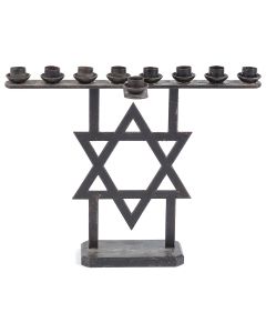 Uncommon, industrial-like design, of simple and balanced linear form with large, central Star-of-David supporting single bar supporting nine candle sockets. 7.25 x 9.25 inches.