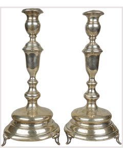 Of classic, baluster shape, set on three supports. Marked. Height: 15 inches (37 cm). One candle-socket misshapen.