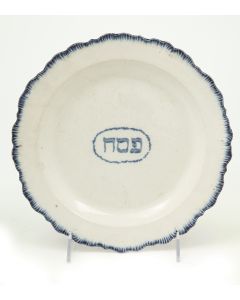 Blue underglaze and featuring the Hebrew word “Pesach.” Diam: 9.5 inches.