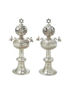 Uniformly set on large round bases with circular midsections. Upper portions bulbous. Fitted with bells, each topped with a Star-of-David. Height: 15.2 inches (36.6 cm).