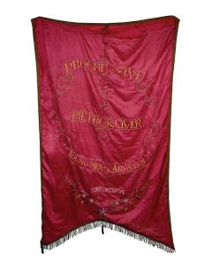Large, two sided, hand embroidered silk banner. Text in Yiddish and English surrounded by flowers. “Made by Garechtman’s.” Tears in two spots on the edge (unaffecting signage). 30 x 52 inches (76 x.133 cm).