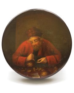 Lacquered lidded keepsake box featuring Jewish money-lender adorned in red turban and pince-nez, with coins arrayed before him. Diameter: 4 inches.