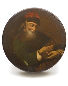 Lacquered lidded keepsake box featuring Oriental Jewish merchant garbed in red tasseled smoking hat, with coins and money pouch in foreground. Diameter: 4 inches.
