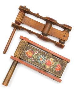 Wooden festive noise-maker featuring panel of painted floral design, with red trim throughout. 6.25 x 6.75 inches.
<<* And:>> Carved wooden festive noise-maker with playful baluster slats. 6.75 x 7.25 inches.