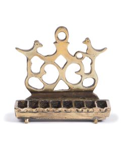 Cast rectangular backplate with openwork tendrils flanked by two pheasants and surmounted by suspension ring. Below, attached row of eight oil receptacles. 4.5 x 4.75 inches.