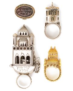 Three decorative Jewish betrothal rings with inscriptions in Hebrew and featuring miniature palaces representing the marital home. <<* And:>> Carnelian signet ring bearing Biblical verse. (Range: 1.25-3.75 inches).