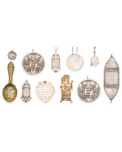 Eleven amulets of various forms, including: Disc, hand, shield, spoon, etc. Each engraved or embossed with Hebrew Biblical verses, Kabbalistic phraseology, along with iconographic symbols. Few, suspended. (Range: 1.25 - 6.25 inches).