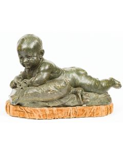 Sculpture. Reclining baby boy. Signed: “B. Chatz, Paris 1893.” Mounted on velvet-lined base. Chipped. 14 x 25 x 12 inches.