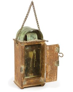 Rectangular form with glass window and hinged door, topped with decorative double-arch. Fitted with candle-holder. Attached hanging- chain. 9.25 x 5 x 3 inches.