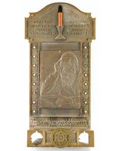 Featuring large relief of elderly Jewish man surrounded by floral motif, accented with colored gemstones. With associated family inscriptions. Memorial-candle holder bracket. Height: 31 inches.