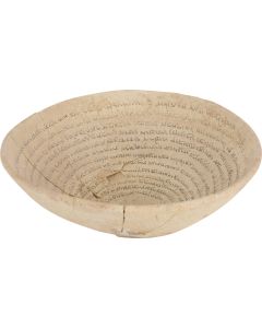 An ancient Jewish-Babylonian incantation bowl with an outward spiraling text inscription in thirteen lines and inviting the Angel Metatron. Diam: 6.75 inches (17 cm).