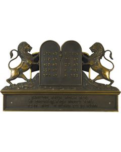 Rampant lions flanking Hebrew Decalogue; base with Hebrew dedicatory inscription, dated 1934. 32 x 19.5 inches (81.3 x 49.5cm).